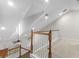 Bright loft with vaulted ceilings, wood railing, and plenty of natural light from the large windows at 20113 Bending Creek Pl, Tampa, FL 33647