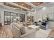 Inviting lounge area featuring a mix of comfortable seating arrangements, stylish decor, and wood flooring at 20113 Bending Creek Pl, Tampa, FL 33647
