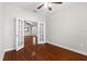 Spacious room with hardwood floors and double doors leading to another area at 20113 Bending Creek Pl, Tampa, FL 33647