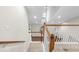 View from top of staircase down into foyer with hardwood floors at 20113 Bending Creek Pl, Tampa, FL 33647