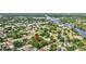 Aerial view showcasing a home's location within a picturesque neighborhood near a tranquil river at 2106 W Saint Isabel St, Tampa, FL 33607
