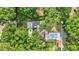 Birds-eye view of a property highlighting mature landscaping, updated driveway and fenced yard at 2106 W Saint Isabel St, Tampa, FL 33607