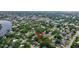 Sprawling aerial view of a home's location within a lush neighborhood close to shopping and waterways at 2106 W Saint Isabel St, Tampa, FL 33607