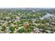 Aerial view of a beautiful home nestled in a neighborhood near a scenic river and downtown skyline at 2106 W Saint Isabel St, Tampa, FL 33607