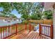 Beautiful fenced backyard featuring a wooden deck and lush greenery at 2106 W Saint Isabel St, Tampa, FL 33607