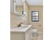 Well-lit bathroom with a white vanity, updated faucet, and a large mirror at 2106 W Saint Isabel St, Tampa, FL 33607