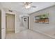 Bright bedroom featuring neutral paint, wood-look tile floors, and a mirrored closet at 2106 W Saint Isabel St, Tampa, FL 33607