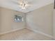 Simple bedroom with wood-look tile flooring, neutral paint and good natural light at 2106 W Saint Isabel St, Tampa, FL 33607