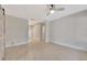 Spacious and bright living area with neutral walls and stylish wood-look tile flooring at 2106 W Saint Isabel St, Tampa, FL 33607