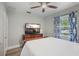 Serene bedroom featuring a comfortable bed, entertainment center, and modern decor for a relaxing ambiance at 249 41St Ne Ave, St Petersburg, FL 33703
