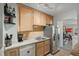 Efficient kitchen area with stainless steel refrigerator, and dishwasher at 249 41St Ne Ave, St Petersburg, FL 33703
