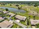 Aerial view of the house, pond and golf course beyond at 2509 Locksley St # 237, Sun City Center, FL 33573