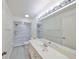 Clean bathroom featuring white marble tile shower, modern sink with vanity, and bright lighting at 2509 Locksley St # 237, Sun City Center, FL 33573