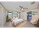 Staged primary bedroom with tile floors, ceiling fan, windows, and a seating area at 2509 Locksley St # 237, Sun City Center, FL 33573