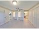 Sunlit bedroom features tile floors, and built-in closets for organized storage at 2509 Locksley St # 237, Sun City Center, FL 33573