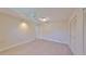 Bright bedroom with tiled floor and ceiling fan, enhanced by a spacious closet for ample storage at 2509 Locksley St # 237, Sun City Center, FL 33573