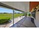 Enjoy the covered patio with views of the manicured lawn and landscaping at 2509 Locksley St # 237, Sun City Center, FL 33573
