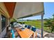 Relax on the covered patio with comfortable seating and views of the lake at 2509 Locksley St # 237, Sun City Center, FL 33573
