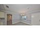 Elegant dining room featuring a chandelier, gray walls, and tile flooring at 2509 Locksley St # 237, Sun City Center, FL 33573