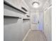 Entry hallway with floating shelves, plank flooring, and closet storage at 2509 Locksley St # 237, Sun City Center, FL 33573