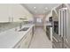 Modern kitchen features stainless steel appliances, sleek white cabinets, and ample countertop space at 2509 Locksley St # 237, Sun City Center, FL 33573
