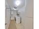 Efficient laundry room with washer, dryer, storage shelves, and cabinets for organized convenience at 2509 Locksley St # 237, Sun City Center, FL 33573