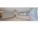 Large living room with tile floors, ceiling fans, and natural light at 2509 Locksley St # 237, Sun City Center, FL 33573