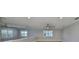Bright upper-level living space, boasting ceiling fans, recessed lights and natural light from the windows at 2509 Locksley St # 237, Sun City Center, FL 33573