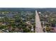 Expansive aerial view highlights lush landscaping and community alongside a thoroughfare at 2693 Sabal Springs Cir # 206, Clearwater, FL 33761
