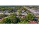 Birds eye view of the property surrounded by mature trees and local businesses at 2693 Sabal Springs Cir # 206, Clearwater, FL 33761