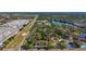 An aerial view of a neighborhood featuring both single-Gathering homes and townhouses with pools, tennis courts, and other amenities at 2693 Sabal Springs Cir # 206, Clearwater, FL 33761