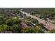 Aerial view of complex nestled amidst lush greenery, adjacent to a well-trafficked thoroughfare at 2693 Sabal Springs Cir # 206, Clearwater, FL 33761
