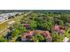 Scenic aerial view showcasing the condo complex surrounded by lush greenery and mature trees at 2693 Sabal Springs Cir # 206, Clearwater, FL 33761