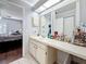 Bright bathroom featuring a vanity with sink, ample counter space, and storage cabinets at 2693 Sabal Springs Cir # 206, Clearwater, FL 33761