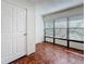 Bedroom with parquet floors and large windows overlooking the outside at 2693 Sabal Springs Cir # 206, Clearwater, FL 33761