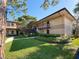 Inviting condo exterior featuring lush landscaping and a well-maintained building facade at 2693 Sabal Springs Cir # 206, Clearwater, FL 33761