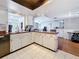 Bright kitchen featuring butcher block countertops and an open design leading to the living room at 2693 Sabal Springs Cir # 206, Clearwater, FL 33761