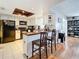 Open-concept kitchen with breakfast bar and stainless steel appliances, adjacent to living area at 2693 Sabal Springs Cir # 206, Clearwater, FL 33761