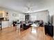 Comfortable living room featuring hardwood floors, ceiling fan, and comfortable seating at 2693 Sabal Springs Cir # 206, Clearwater, FL 33761