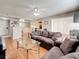 Spacious living room with hardwood floors, ceiling fan and comfortable seating at 2693 Sabal Springs Cir # 206, Clearwater, FL 33761