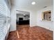 Bright living room featuring parquet floors and a view to the kitchen and living room at 2693 Sabal Springs Cir # 206, Clearwater, FL 33761