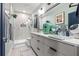 Bathroom featuring a modern vanity, a large mirror, and a glass-enclosed shower at 2810 N Florida Ave, Tampa, FL 33602