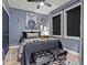 Stylish bedroom with dark color scheme, striking wall art and a window that offers natural light at 2810 N Florida Ave, Tampa, FL 33602