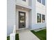 Modern home featuring a stylish front door and manicured landscaping at 2810 N Florida Ave, Tampa, FL 33602