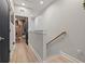 Hallway with wood floors and natural lighting showcasing an open door at 2810 N Florida Ave, Tampa, FL 33602