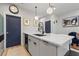 Chic kitchen island with modern faucet, sink, and bar stool seating enhances the living space at 2810 N Florida Ave, Tampa, FL 33602