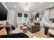 Well-lit living room showcasing comfortable seating, stylish decor, and an inviting atmosphere for relaxation at 2810 N Florida Ave, Tampa, FL 33602