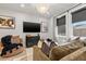 Comfortable living room boasts a large sofa, stylish decor, and natural light from nearby windows at 2810 N Florida Ave, Tampa, FL 33602