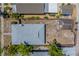 Aerial view showcasing the home's new roof, back yard, detached garage, and surrounding greenery at 2835 Dartmouth N Ave, St Petersburg, FL 33713