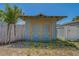 Backyard shed featuring double doors and a secure fence line at 2835 Dartmouth N Ave, St Petersburg, FL 33713